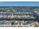 Aerial view showcases homes along a network of canals leading to open waters and the Gulf of Mexico at 259 Fields Ter, Port Charlotte, FL 33952