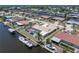 Aerial view of waterfront property featuring a pool and private boat dock at 259 Fields Ter, Port Charlotte, FL 33952