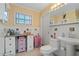 Bathroom features an updated sink with tile floor and medicine cabinet at 259 Fields Ter, Port Charlotte, FL 33952