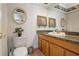 Charming bathroom featuring warm granite countertop and decorative gold framed mirror at 259 Fields Ter, Port Charlotte, FL 33952