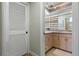 View into bathroom with light-colored vanity, a sink, and a linen closet at 259 Fields Ter, Port Charlotte, FL 33952