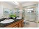 Bathroom features a double sink, framed mirror, and shower/tub combination at 259 Fields Ter, Port Charlotte, FL 33952
