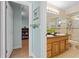Bathroom features a double sink, framed mirror, and shower/tub combination at 259 Fields Ter, Port Charlotte, FL 33952