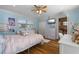 Light and airy bedroom with hardwood floors and view of attached bathroom at 259 Fields Ter, Port Charlotte, FL 33952