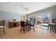 Dining area with pool view features a custom wine rack and a ceiling fan at 259 Fields Ter, Port Charlotte, FL 33952