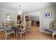 Dining room with glass table, ornate chairs, and bright chandelier at 259 Fields Ter, Port Charlotte, FL 33952