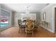 Bright dining room featuring chandelier, wainscoting, and view of backyard pool at 259 Fields Ter, Port Charlotte, FL 33952