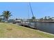 Waterfront property features a private dock with boat access and scenic views of the surrounding waterway at 259 Fields Ter, Port Charlotte, FL 33952