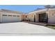 Home with a two-car garage, tile roof, and landscaped entrance at 259 Fields Ter, Port Charlotte, FL 33952