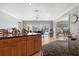 Kitchen island with granite counter top looking out to a backyard pool and patio at 259 Fields Ter, Port Charlotte, FL 33952