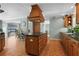 Kitchen with large center island featuring cooktop and ample storage; adjoins to eat-in area at 259 Fields Ter, Port Charlotte, FL 33952