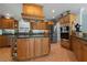 Spacious kitchen with wood cabinets, granite countertops, stainless steel appliances, and ample storage space at 259 Fields Ter, Port Charlotte, FL 33952