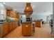 Open kitchen features a center island, tiled floor, stainless steel appliances and recessed lighting at 259 Fields Ter, Port Charlotte, FL 33952