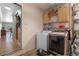 Efficient laundry room features updated appliances, ample storage, and easy access to the home's interior at 259 Fields Ter, Port Charlotte, FL 33952