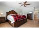 Bedroom with hardwood floors, ceiling fan, and access to an en-suite bath at 259 Fields Ter, Port Charlotte, FL 33952