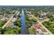 Stunning aerial view of a waterfront community with lush landscaping and canal access at 2626 Auburn Blvd, Port Charlotte, FL 33948