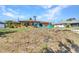 This home boasts a spacious yard perfect for outdoor entertaining, with room for grilling and lawn games at 2626 Auburn Blvd, Port Charlotte, FL 33948