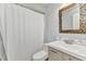 Bathroom with a shower and a vanity with a sink and a mosaic mirror at 2626 Auburn Blvd, Port Charlotte, FL 33948