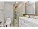 Modern bathroom featuring a glass-enclosed shower, white vanity, and sleek fixtures at 2626 Auburn Blvd, Port Charlotte, FL 33948