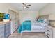 This bright bedroom features wood-look flooring and ample storage space with white closet doors at 2626 Auburn Blvd, Port Charlotte, FL 33948