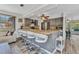 Kitchen with a breakfast bar, stainless steel appliances, tile countertops and gray cabinets at 2626 Auburn Blvd, Port Charlotte, FL 33948