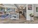 Open-concept kitchen with stainless steel appliances and a breakfast bar that overlooks the living area at 2626 Auburn Blvd, Port Charlotte, FL 33948