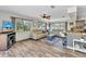 Inviting living room with wood floors, lots of windows, and comfortable seating at 2626 Auburn Blvd, Port Charlotte, FL 33948