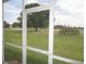 View from the back porch showing a lush green lawn with mature trees in the distance at 26430 Rampart Blvd # 511, Punta Gorda, FL 33983