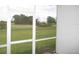 Green lawns stretch out from the back porch, offering serene views and a sense of openness at 26430 Rampart Blvd # 511, Punta Gorda, FL 33983