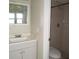 Bathroom featuring a vanity with a sink and a walk-in shower at 26430 Rampart Blvd # 511, Punta Gorda, FL 33983