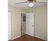 Neutral bedroom with ceiling fan and wood-look flooring creating a welcoming space at 26430 Rampart Blvd # 511, Punta Gorda, FL 33983