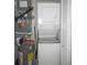 Efficient stacked washer and dryer unit next to the water heater maximizes laundry space at 26430 Rampart Blvd # 511, Punta Gorda, FL 33983