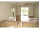 Open-concept living room with wood floors and sliding glass doors to the screened-in porch at 26430 Rampart Blvd # 511, Punta Gorda, FL 33983