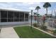 Community pool with a screened area and tropical landscaping adds resort style appeal at 26430 Rampart Blvd # 511, Punta Gorda, FL 33983