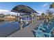 Private boat lift, Yamaha outboard, seating area, and canal front access on a sunny day at 3225 Magnolia Way, Punta Gorda, FL 33950