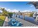 Enjoy waterfront living from this private dock with seating, boat and lift at 3225 Magnolia Way, Punta Gorda, FL 33950