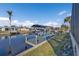 Private boat dock with a covered boat lift and seating area on the canal at 3225 Magnolia Way, Punta Gorda, FL 33950