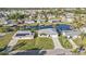 Well-maintained single-story home with a driveway, lawn, and mature trees at 3225 Magnolia Way, Punta Gorda, FL 33950