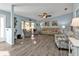 Bright, light-blue living room showcasing modern flooring, neutral furniture, and comfortable seating at 3225 Magnolia Way, Punta Gorda, FL 33950