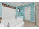 Main bathroom featuring a large tub with jets, a window, and a separate shower at 3225 Magnolia Way, Punta Gorda, FL 33950