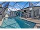 Spacious screened in pool with patio seating and an outdoor entertaining area at 3225 Magnolia Way, Punta Gorda, FL 33950