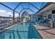 Covered pool with clear blue water, patio seating, and an outdoor living space at 3225 Magnolia Way, Punta Gorda, FL 33950