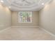 Comfortable bedroom featuring a ceiling fan, recessed lights, and a window with views of palm trees at 3314 Wood Thrush Dr # 124, Punta Gorda, FL 33950