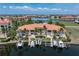 Expansive waterfront condo building with boat docks and balconies, offering breathtaking panoramic vistas at 3314 Wood Thrush Dr # 124, Punta Gorda, FL 33950