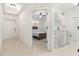 Hallway view showcasing bedroom with bed, and laundry room with appliances at 3314 Wood Thrush Dr # 124, Punta Gorda, FL 33950