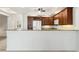 Charming kitchen featuring wooden cabinetry, modern appliances, and a breakfast bar for casual dining at 3314 Wood Thrush Dr # 124, Punta Gorda, FL 33950