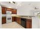 Bright and airy kitchen features wooden cabinetry, granite countertops, and modern appliances at 3314 Wood Thrush Dr # 124, Punta Gorda, FL 33950