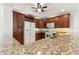 Inviting kitchen area with wood cabinets, modern appliances, bar seating and stone countertops at 3314 Wood Thrush Dr # 124, Punta Gorda, FL 33950