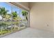 Screened-in lanai provides stunning water views, tropical trees, and beautiful surrounding landscape at 3314 Wood Thrush Dr # 124, Punta Gorda, FL 33950