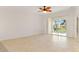 Bright, open living space with sliding glass doors leading to lanai and tiled floors at 3314 Wood Thrush Dr # 124, Punta Gorda, FL 33950
